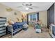 Bedroom featuring a ceiling fan, window and twin size bed with a desk for working or schoolwork at 14034 E Utah Cir, Aurora, CO 80012