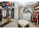 This spacious walk-in closet includes laundry hookups and storage for clothing and shoes at 14034 E Utah Cir, Aurora, CO 80012