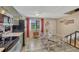 Open kitchen with stainless steel appliances and adjacent dining space at 14034 E Utah Cir, Aurora, CO 80012