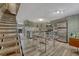 Bright kitchen with sleek appliances and a dining area with a glass-top table at 14034 E Utah Cir, Aurora, CO 80012