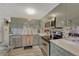 Well-appointed kitchen with modern appliances, tiled backsplash, and ample cabinet space at 14034 E Utah Cir, Aurora, CO 80012