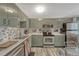Stylish kitchen with stainless steel appliances, white countertops, and decorative backsplash at 14034 E Utah Cir, Aurora, CO 80012