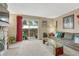 Comfortable living room featuring a stone fireplace and sliding glass doors to the backyard at 14034 E Utah Cir, Aurora, CO 80012