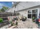 Charming outdoor patio with a dining area, comfortable seating, and a garden bed at 14034 E Utah Cir, Aurora, CO 80012