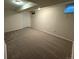 Cozy finished basement with neutral carpet, lighting, and window at 2991 S Whiting Way, Denver, CO 80231