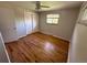 Cozy bedroom featuring lustrous hardwood floors, a ceiling fan and a closet at 2991 S Whiting Way, Denver, CO 80231