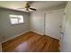 Comfortable bedroom featuring bright hardwood floors, a ceiling fan and a sliding door closet at 2991 S Whiting Way, Denver, CO 80231