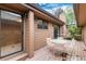 Back deck featuring a white metal table and chairs, perfect for outdoor enjoyment at 7500 E Dartmouth Ave # 16, Denver, CO 80231