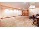 Finished basement with carpet, featuring closet and desk at 7500 E Dartmouth Ave # 16, Denver, CO 80231