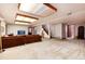 Spacious finished basement with a large sofa and bright lighting at 7500 E Dartmouth Ave # 16, Denver, CO 80231