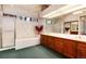 Bright bathroom featuring a soaking tub, walk-in shower, and generous countertop space at 7500 E Dartmouth Ave # 16, Denver, CO 80231