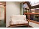 Cozy bedroom with window looking out, featuring chair, bench and doll at 7500 E Dartmouth Ave # 16, Denver, CO 80231