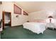 Comfortable bedroom featuring vaulted ceilings, cozy carpeting, and neutral-colored walls at 7500 E Dartmouth Ave # 16, Denver, CO 80231
