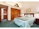 Bright bedroom featuring a storage closet, and neutral-colored walls at 7500 E Dartmouth Ave # 16, Denver, CO 80231