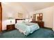 Well-lit bedroom featuring dark furniture, and pale green accents at 7500 E Dartmouth Ave # 16, Denver, CO 80231