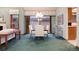 Inviting dining room with a modern chandelier, neutral decor, and a sliding glass door leading to the outside at 7500 E Dartmouth Ave # 16, Denver, CO 80231
