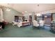 Dining area featuring a stylish table set and lots of light with a view to the living room at 7500 E Dartmouth Ave # 16, Denver, CO 80231