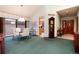 Cozy dining room with a glass table and view to kitchen and entryway at 7500 E Dartmouth Ave # 16, Denver, CO 80231