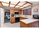 Well-lit kitchen with classic wooden cabinets, white appliances, and tiled countertops, ideal for Gathering cooking at 7500 E Dartmouth Ave # 16, Denver, CO 80231