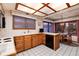 Classic kitchen with light wood cabinets, white countertops, and a cozy breakfast nook with a view at 7500 E Dartmouth Ave # 16, Denver, CO 80231