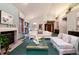 Bright living room showcasing a fireplace, plush seating, and elegant décor at 7500 E Dartmouth Ave # 16, Denver, CO 80231