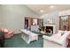 Open-concept living room with fireplace, large windows, and comfortable seating at 7500 E Dartmouth Ave # 16, Denver, CO 80231