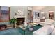 Spacious living room features a cozy fireplace, plush seating, and large windows at 7500 E Dartmouth Ave # 16, Denver, CO 80231