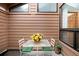 Outdoor patio featuring a table with chairs and flower arrangement at 7500 E Dartmouth Ave # 16, Denver, CO 80231