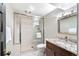 Modern bathroom featuring granite countertops, tile floors, and a tile shower enclosure at 290 Dexter St, Denver, CO 80220