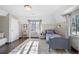 Bright bedroom featuring neutral colors, wood floors, and a light colored rug at 290 Dexter St, Denver, CO 80220
