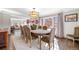 Open-concept dining space with hardwood floors, ample natural light, and views into the living area at 290 Dexter St, Denver, CO 80220