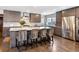 Modern kitchen with stainless steel appliances, granite countertops, and a large island at 290 Dexter St, Denver, CO 80220