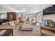 Expansive living area with an open floor plan, a fireplace, and seamless flow to the kitchen at 290 Dexter St, Denver, CO 80220