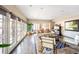 Bright living room with hardwood floors, large windows, comfortable seating and a piano at 290 Dexter St, Denver, CO 80220