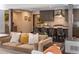 Comfortable living room open to a kitchen with an island and modern cabinetry at 290 Dexter St, Denver, CO 80220