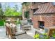 Outdoor brick fireplace and patio area featuring comfortable seating, perfect for entertaining guests at 290 Dexter St, Denver, CO 80220