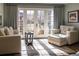 Comfortable sitting area in the main bedroom with French doors that lead to an outdoor view at 290 Dexter St, Denver, CO 80220