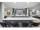 Basement featuring a modern bar with a stone countertop and stylish barstools at 4915 S Vine St, Cherry Hills Village, CO 80113