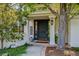 Elegant front door framed by columns and landscaping, creating a grand entrance to the home at 4915 S Vine St, Cherry Hills Village, CO 80113