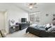 Bright bedroom with a ceiling fan, closet, and a large window that allows for plenty of natural light at 494 Black Feather Loop # 108, Castle Rock, CO 80104