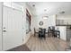 Dining room features hardwood floors and is open to the kitchen with bar seating at 494 Black Feather Loop # 108, Castle Rock, CO 80104