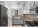 Kitchen features modern stainless appliances, a backsplash and a breakfast bar at 494 Black Feather Loop # 108, Castle Rock, CO 80104