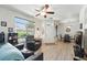 Bright living room with new flooring and large window with a view to the outside at 494 Black Feather Loop # 108, Castle Rock, CO 80104