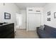 This is a living room with a couch, a window and a dresser at 494 Black Feather Loop # 108, Castle Rock, CO 80104