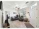 Inviting living room boasts sleek floors and a sun-filled window view to the neighborhood at 494 Black Feather Loop # 108, Castle Rock, CO 80104