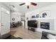 Open concept layout with gas fireplace, kitchen bar and an adjacent dining area at 494 Black Feather Loop # 108, Castle Rock, CO 80104