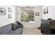 This is a living room with a couch, a window and a dresser at 494 Black Feather Loop # 108, Castle Rock, CO 80104