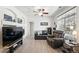 Cozy living room features hardwood floors, a fireplace and an updated ceiling fan at 494 Black Feather Loop # 108, Castle Rock, CO 80104