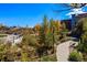 Beautiful park view featuring walking paths, bridges, mature landscaping and a backdrop of nearby buildings at 494 Black Feather Loop # 108, Castle Rock, CO 80104