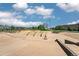 Neighborhood skate park on a clear day featuring concrete ramps and inclines, and a few residents enjoying the space at 494 Black Feather Loop # 108, Castle Rock, CO 80104